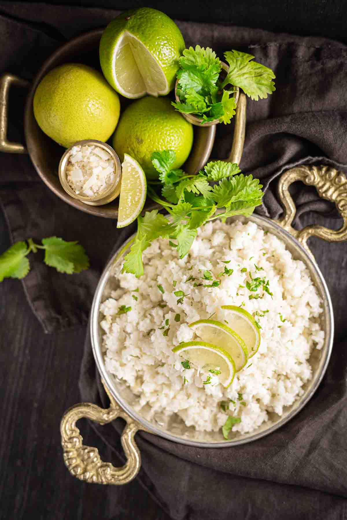 Coconut lime cauliflower rice swerved with limes.