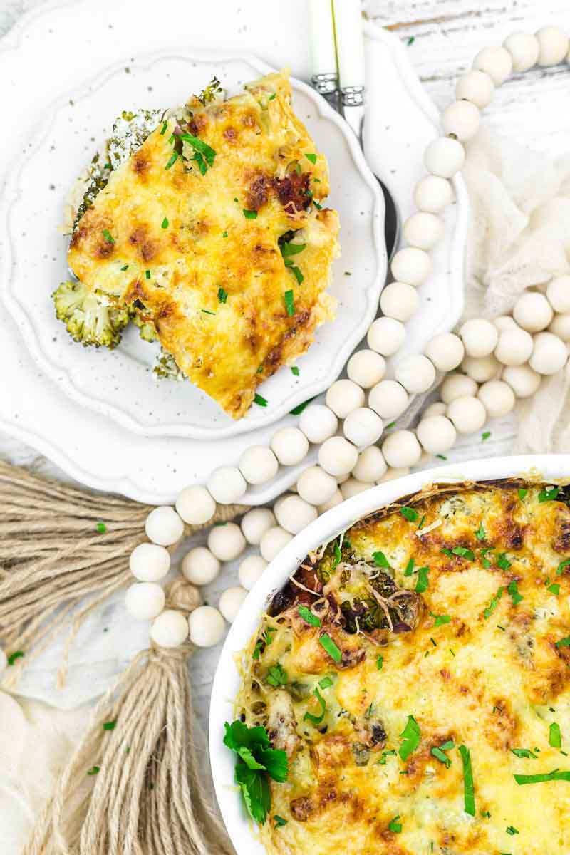 Broccoli casserole on a white plate.