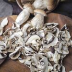 How to dry mushrooms spread on a wood.