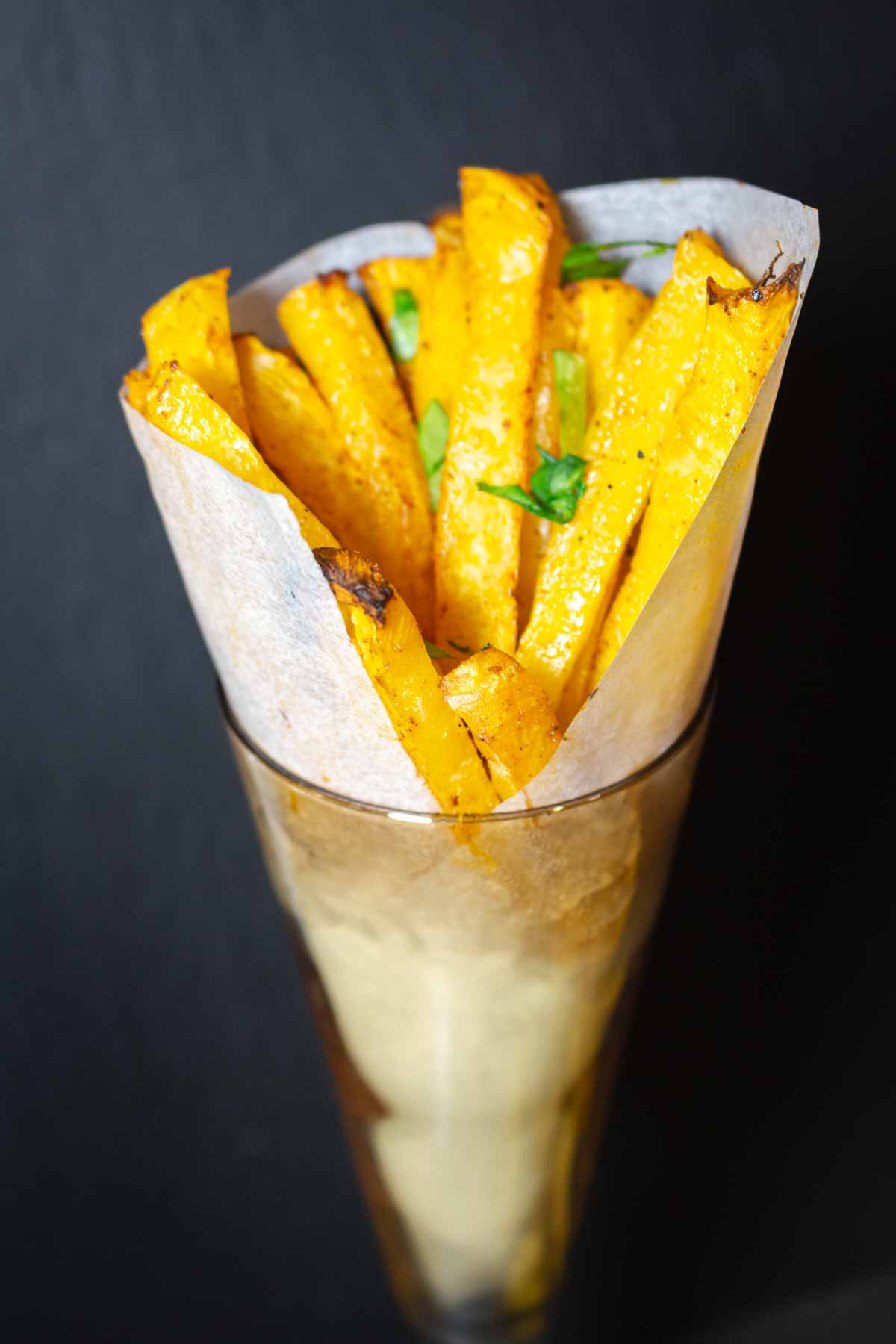 Rutabaga fries for a crowd in a glass.