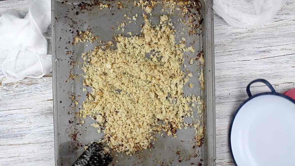 A baking sheet with cauli rice on it.