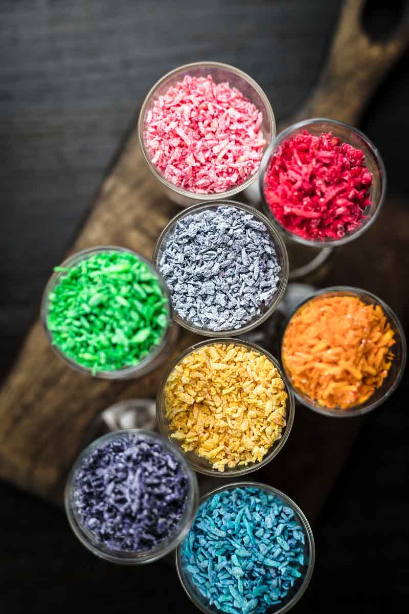 Colorful sprinkles on a wooden table.