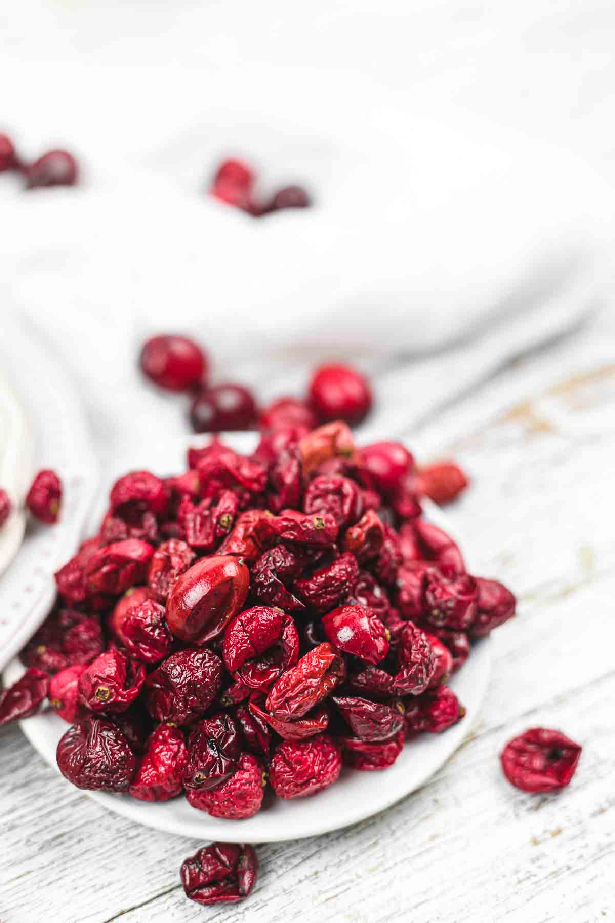 Cranberries on a white plate.