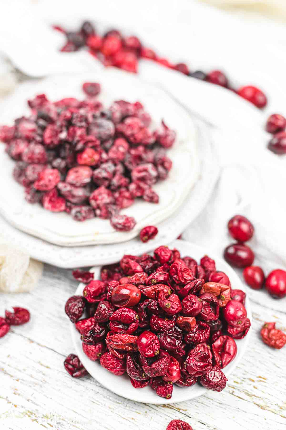 Dried cranberries on a white table.