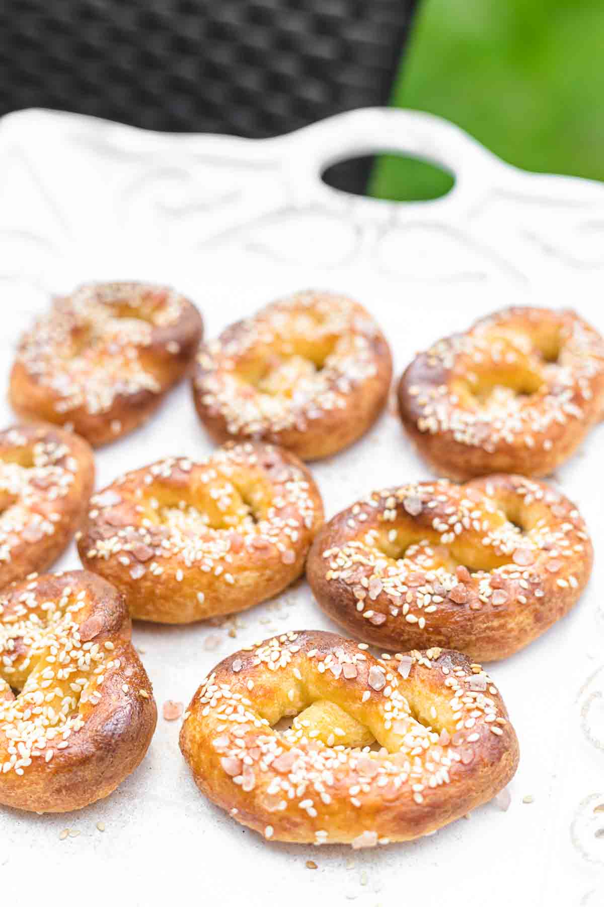 A white tray with pretzels on it.