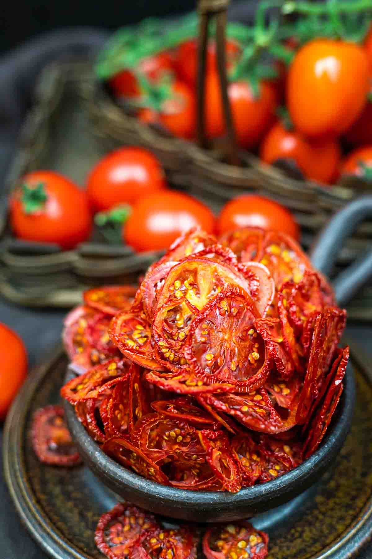 Tomato chips in a bowl on a table.