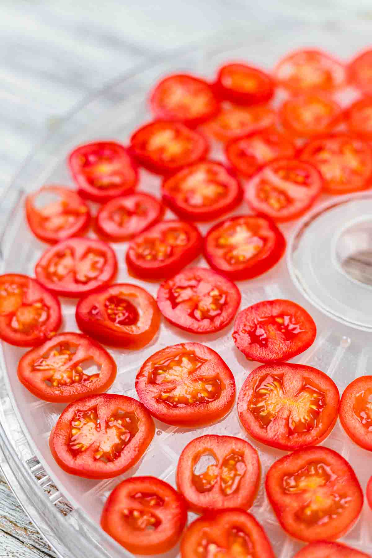 Sliced tomatoes on a tray.