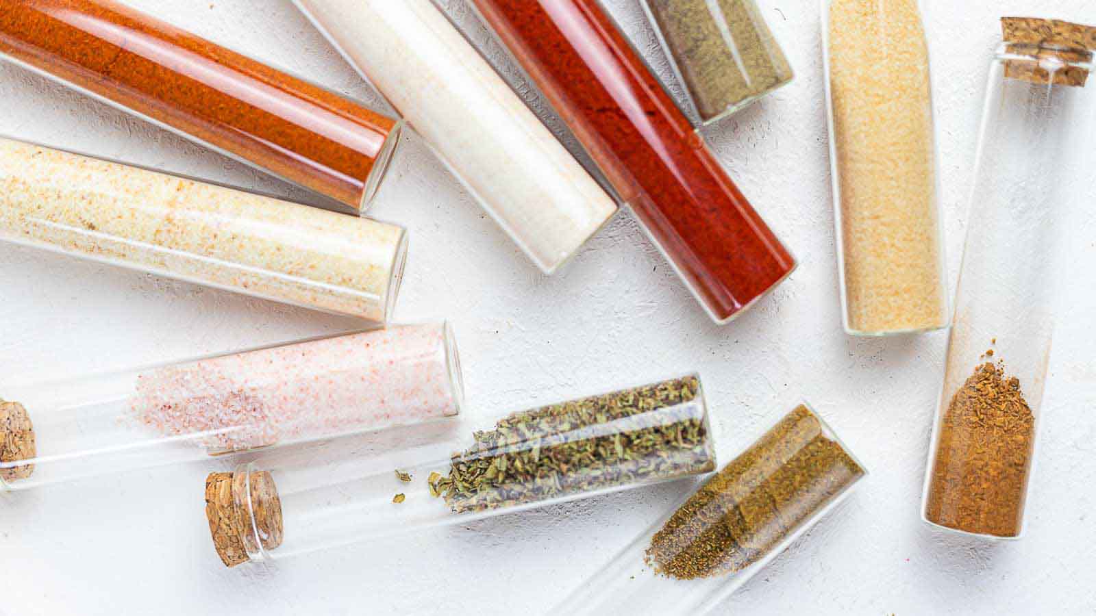 Glass bottles with spices for enchilada seasoning.