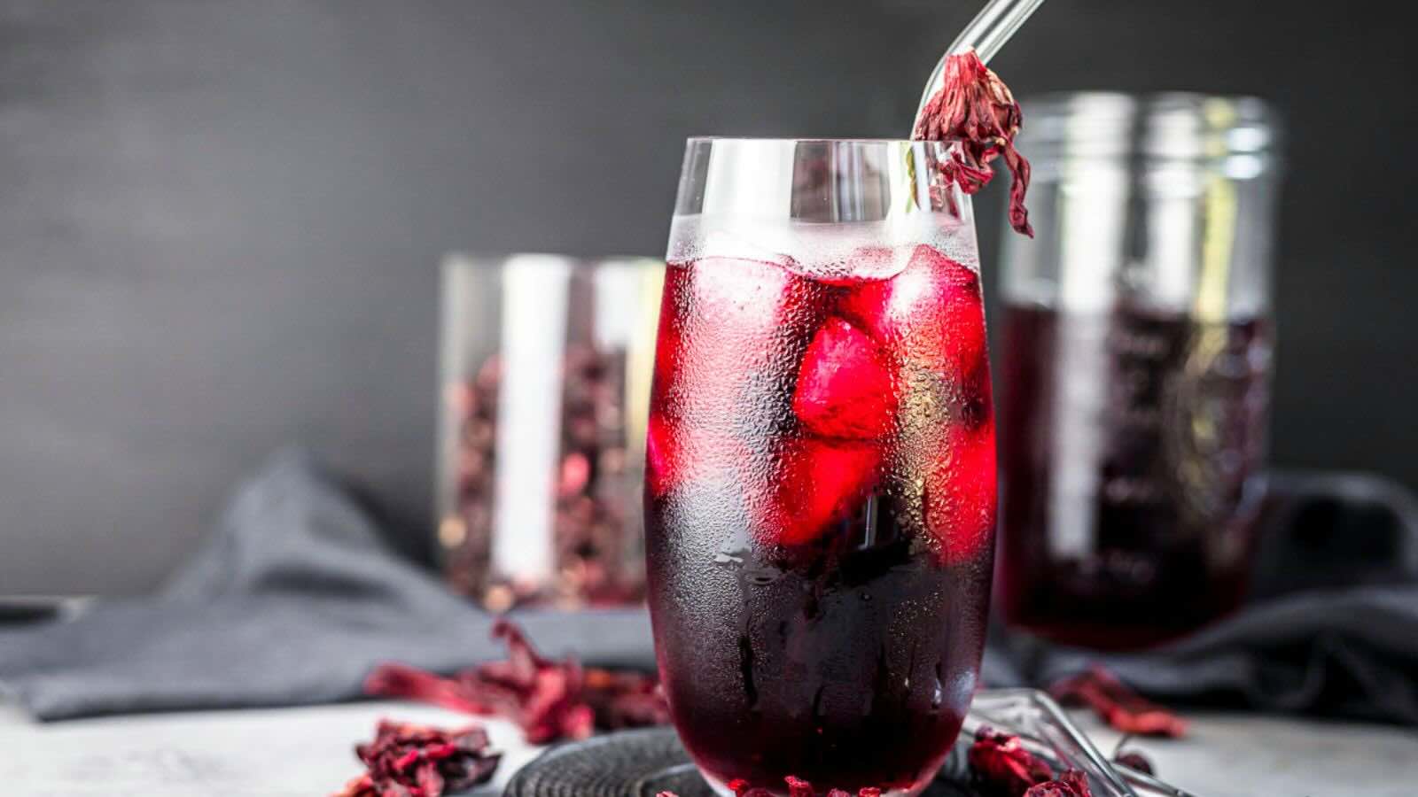 A tall glass filled with a Agua de Jamaica.