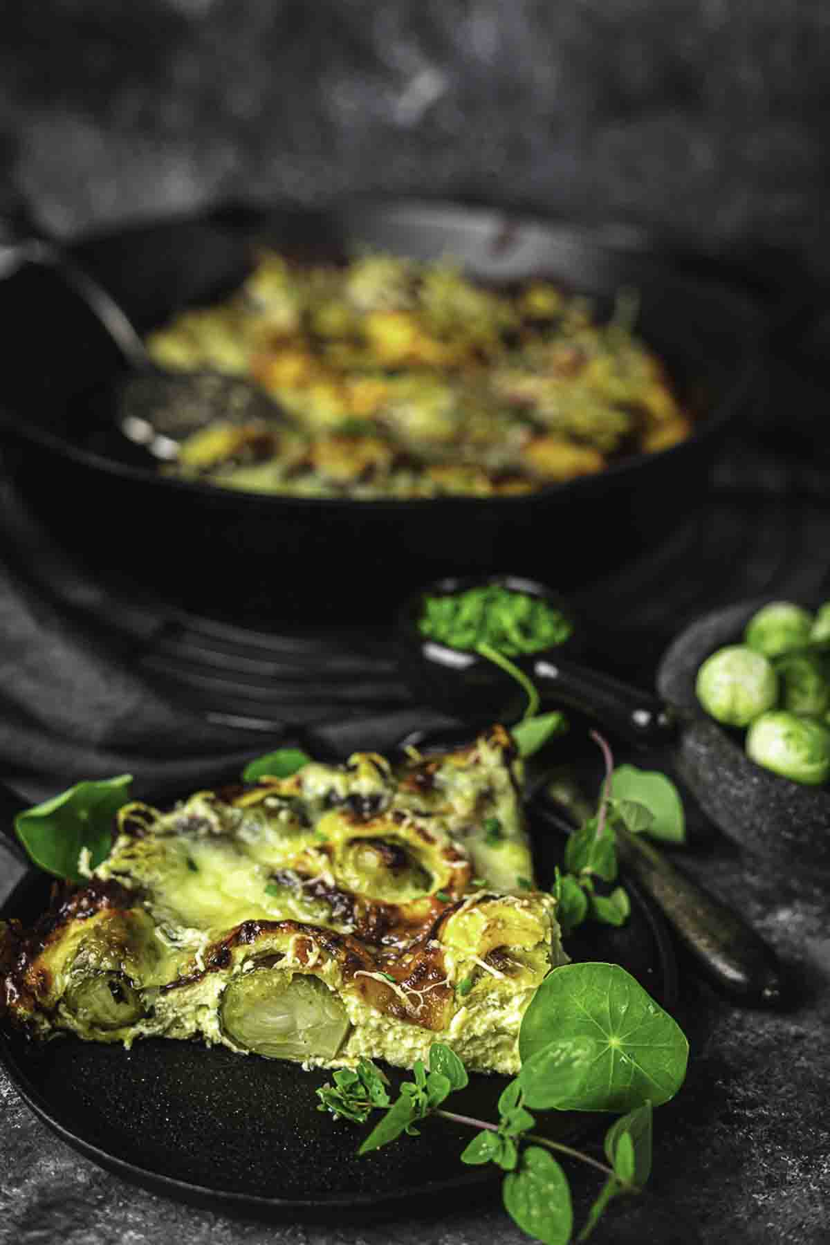 A small plate with a slice of brussel sprouts.