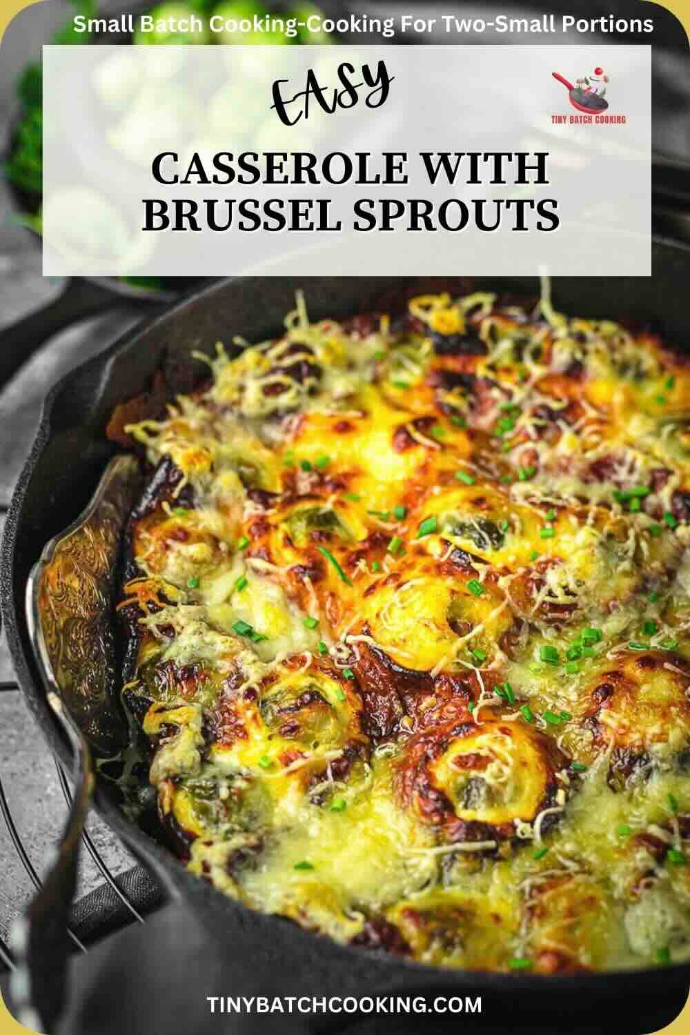 A cast iron casserole with brussel sprouts and cheese.