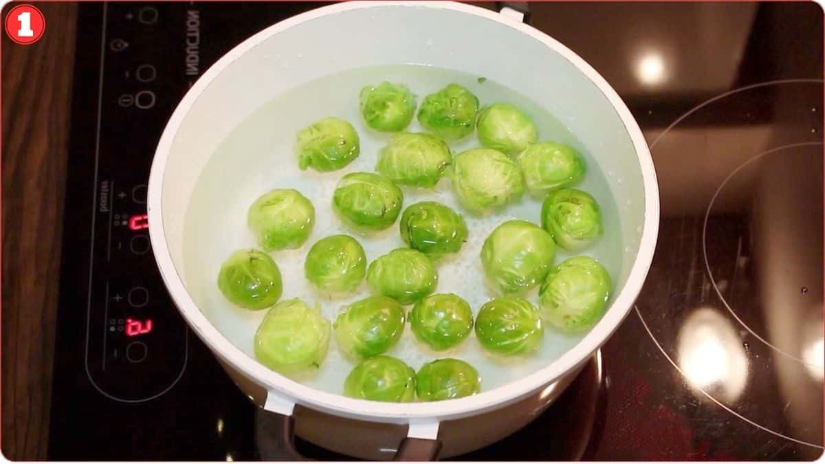 Blanching the brussel sprouts in a pot.