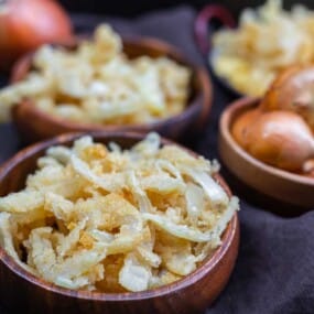 A bowl with crispy fried onions.