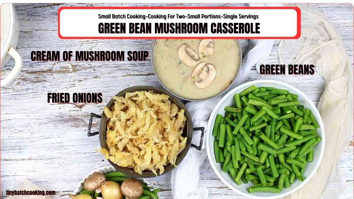 Ingredients for green bean mushroom casserole are displayed, including a bowl of green beans, a dish of fried onions, and a bowl of cream of mushroom soup with mushroom slices on top.