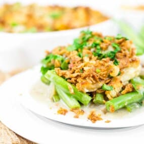 A plate of green bean mushroom casserole with fried onions.
