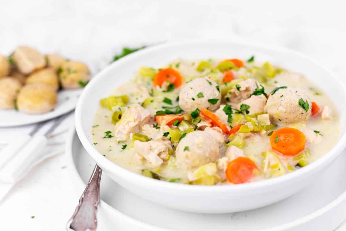 A bowl of homemade chicken soup with dumplings.