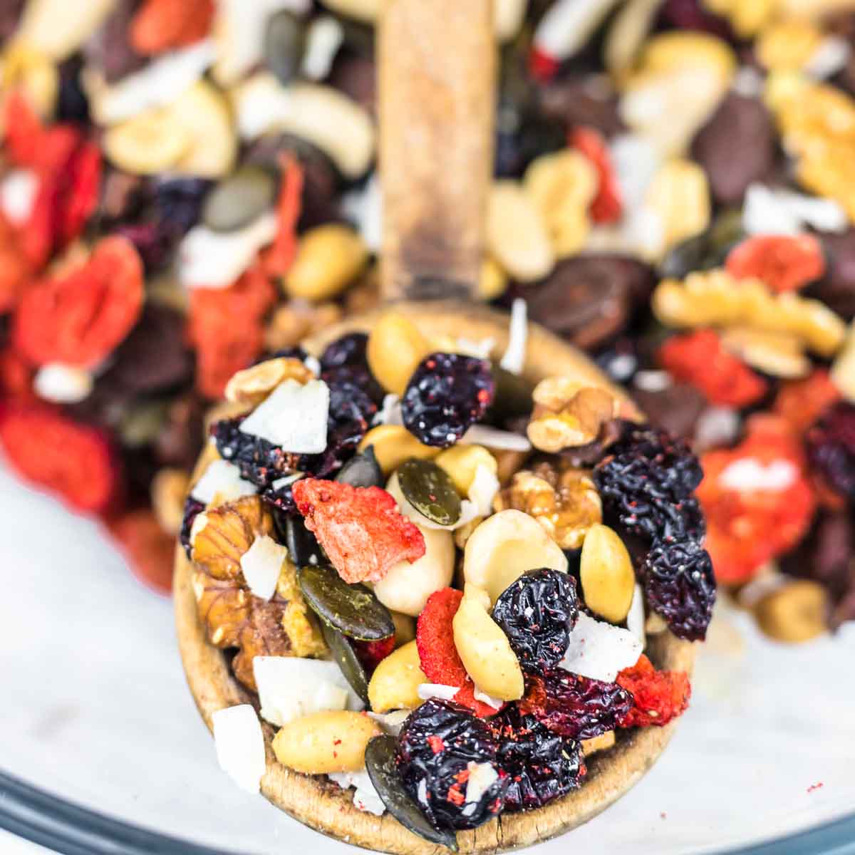 A spoon of nuts trail mix.