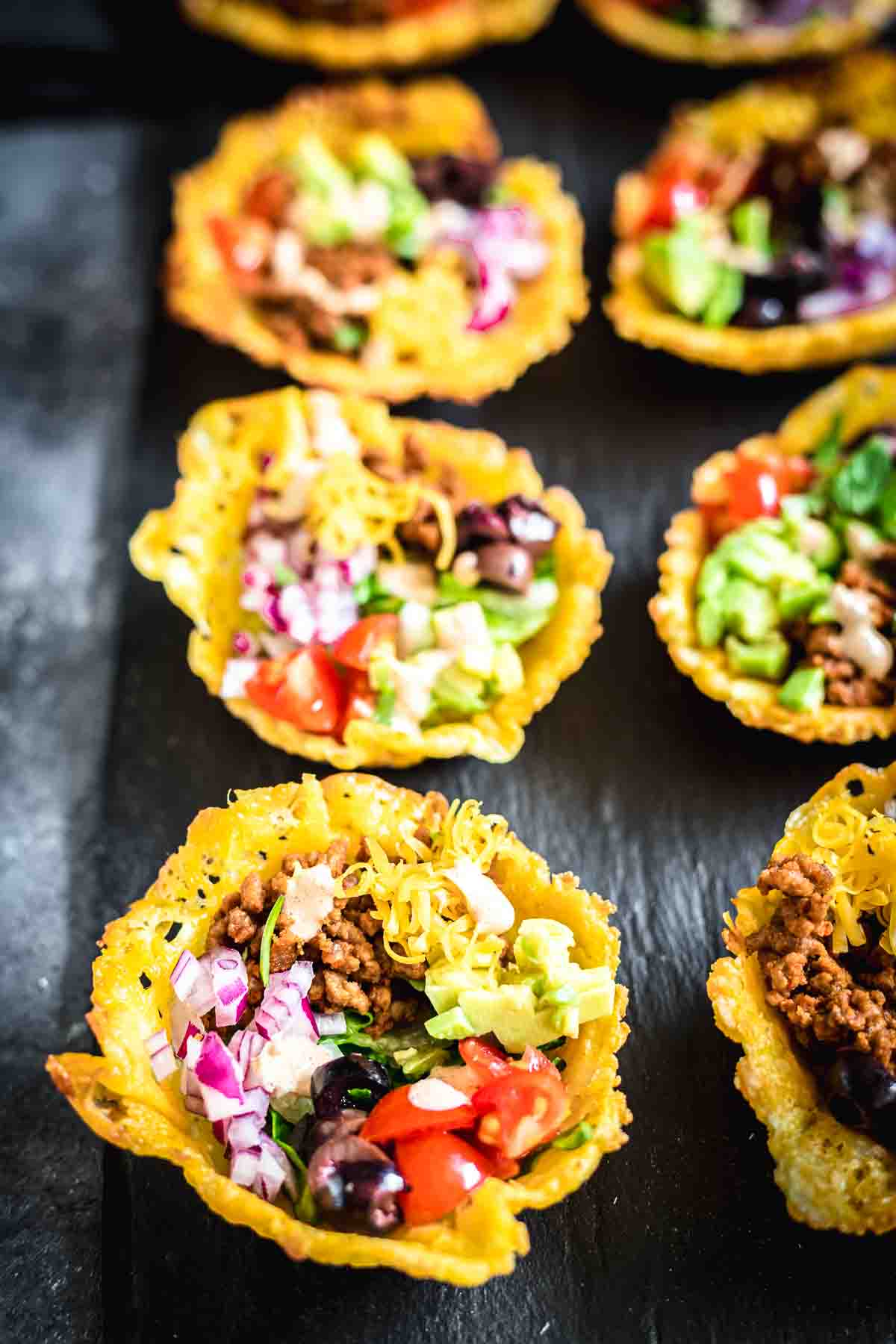 Tacos in small cups.