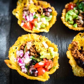 Tacos in small cups.