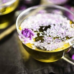 A glass cup filled with tea from roses.
