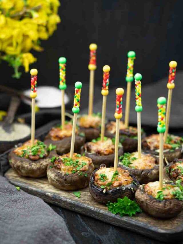 Baked stuffed mushrooms on sticks.