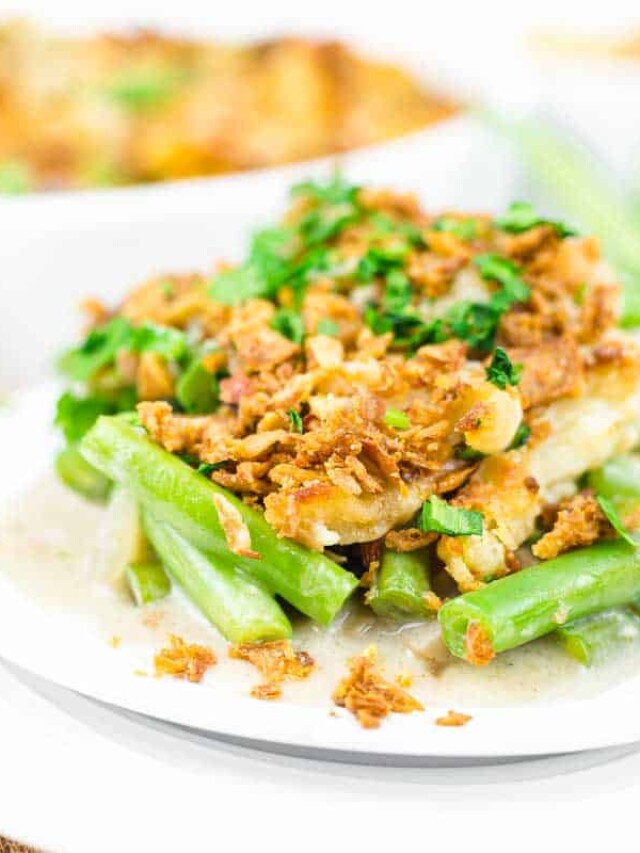 A plate of green bean mushroom casserole with fried onions.