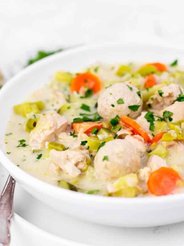 A bowl of homemade chicken soup with dumplings.