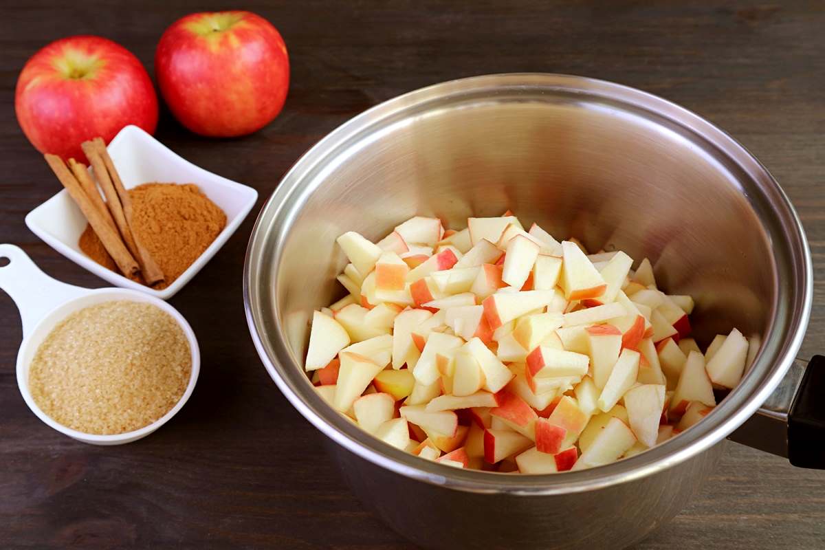 Chopped apples in a large metal bowl.