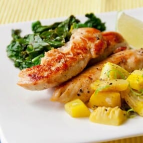 Roasted chicken breast on a plate.