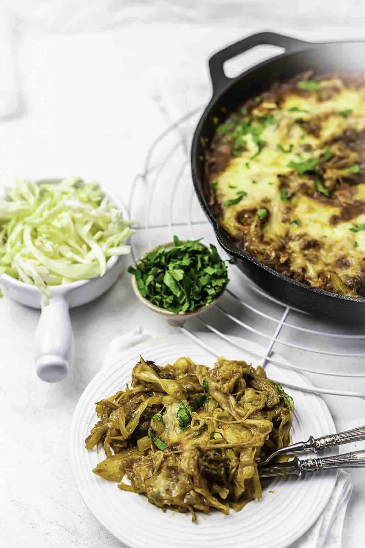 Plated beef veggie casserole with cabbage.