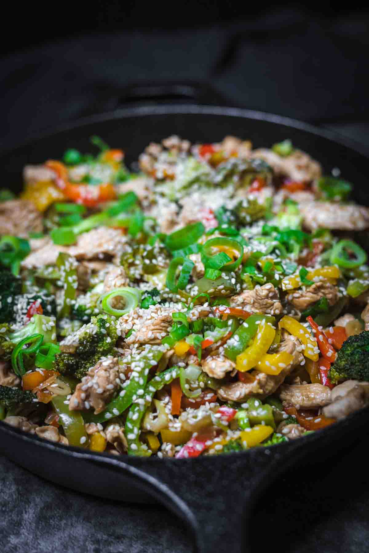 Broccoli and chicken stir-fry with sesame seeds.