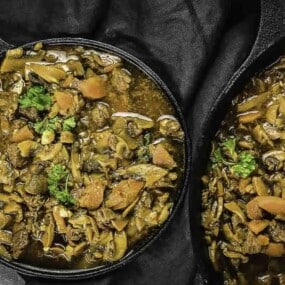 Beef stew topped with fresh parsley.