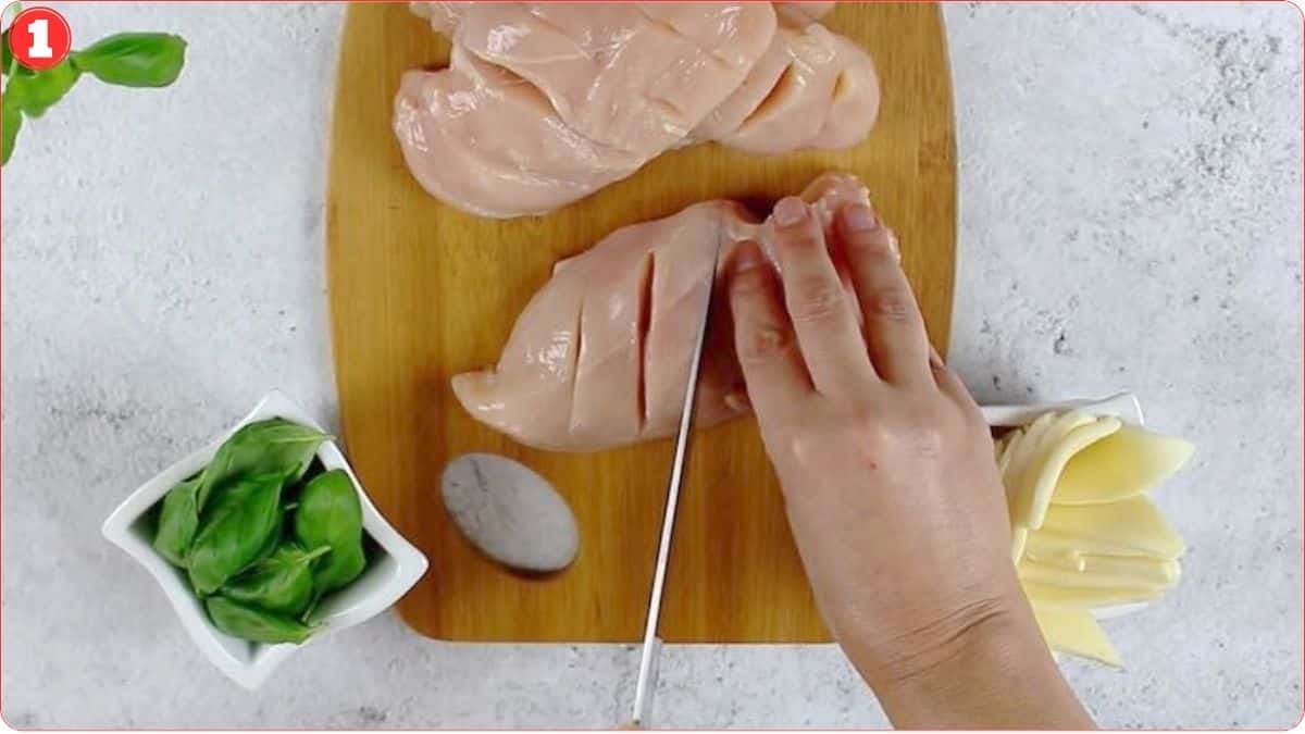 Slicing chicken breasts for stuffing.