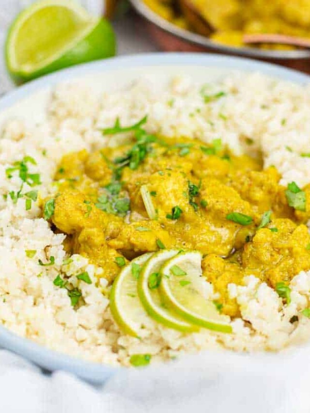 Creamy chicken curry over rice with lime.