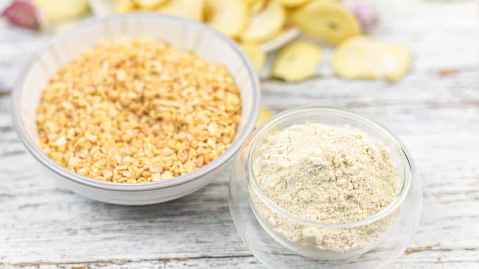 Two bowls contain finely chopped garlic and a light-colored garlic powder.