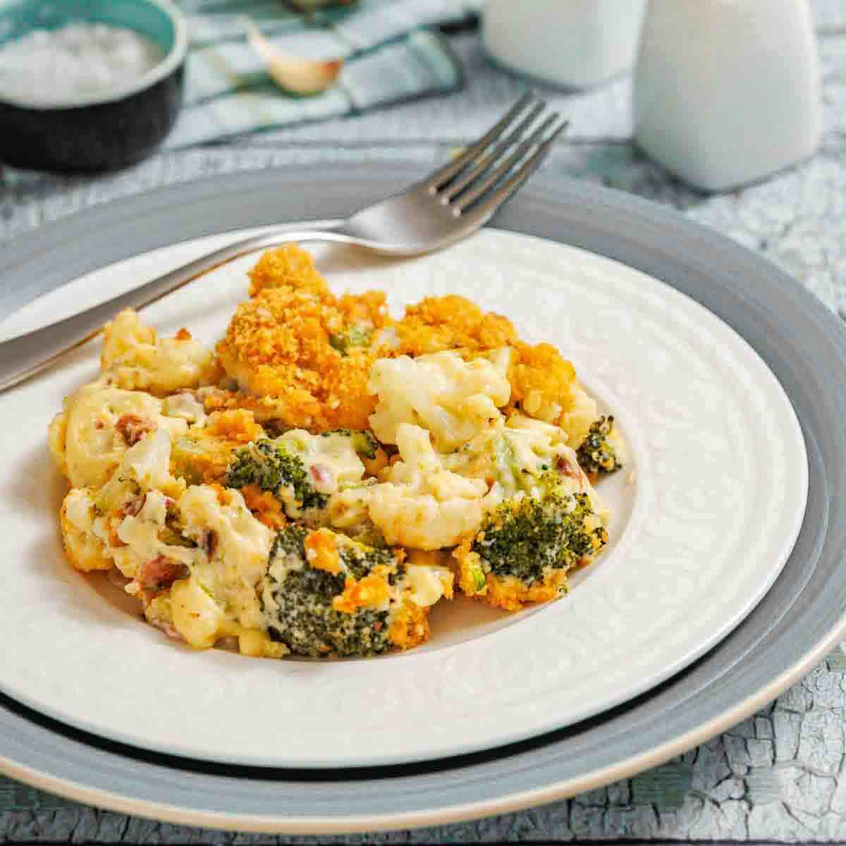 Plate of baked vegetable bacon casserole served.