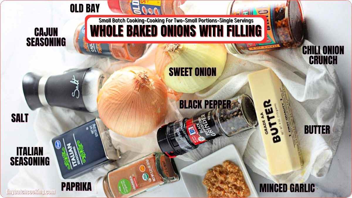 Ingredients for whole baked onions with filling, including whole onions, seasonings, butter, minced garlic, and chili onion crunch, arranged on a white surface and labeled.
