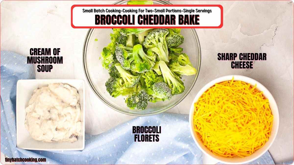 A bowl of broccoli florets, a bowl of shredded sharp cheddar cheese, and a bowl of cream of mushroom soup are arranged on a light surface.