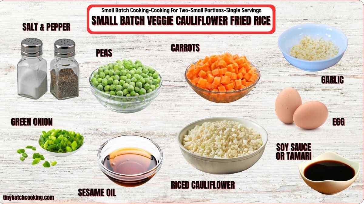 Ingredients for small batch veggie cauliflower fried rice are displayed, including salt, pepper, peas, carrots, garlic, green onion, egg, soy sauce, sesame oil, and riced cauliflower.