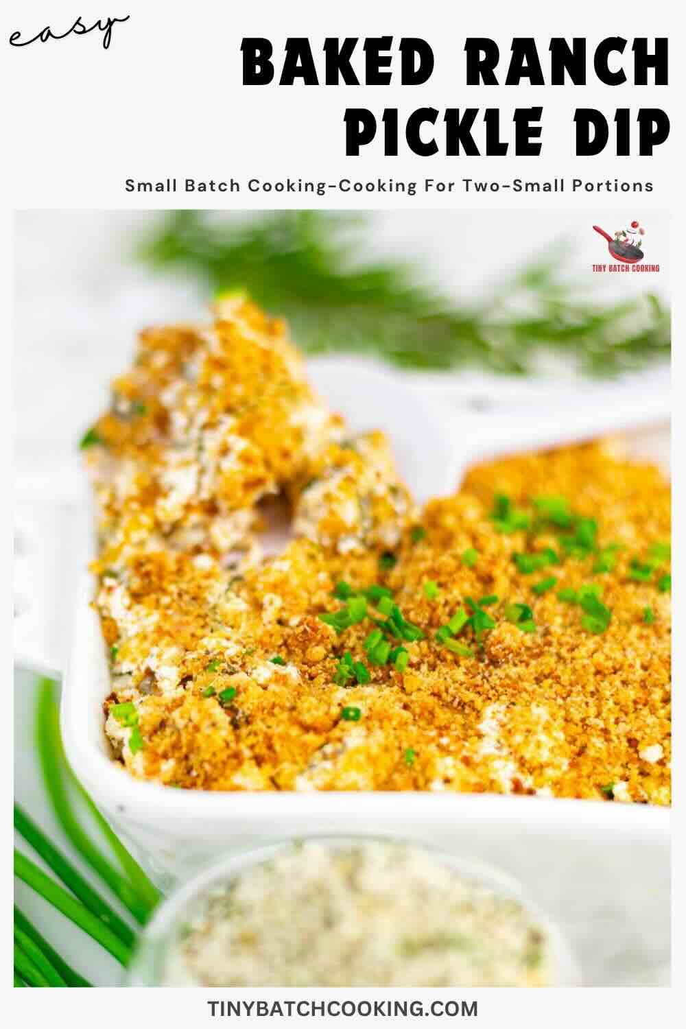 Close-up of a baked ranch pickle dip in a white dish, topped with breadcrumbs and chopped herbs, with text describing the recipe and website branding.