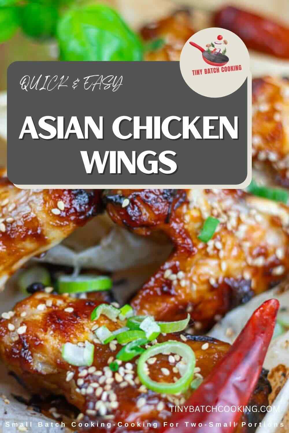 Close-up of glazed Asian chicken wings garnished with sesame seeds, sliced green onions, and red chili peppers.