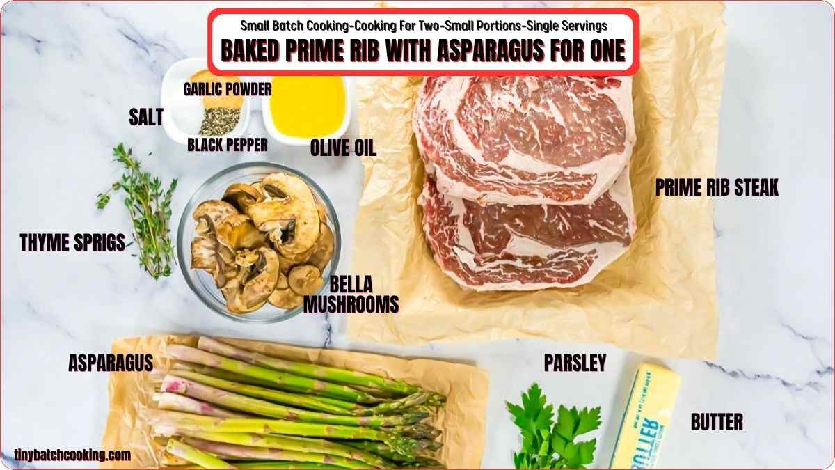 Ingredients for baked prime rib with asparagus: prime rib steak, asparagus, mushrooms, parsley, butter, olive oil, garlic powder, salt, black pepper, and thyme sprigs on a white surface.